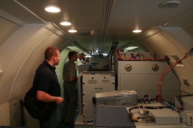 three aircraft interior technicians working